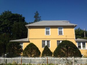 yellow house with gray roof