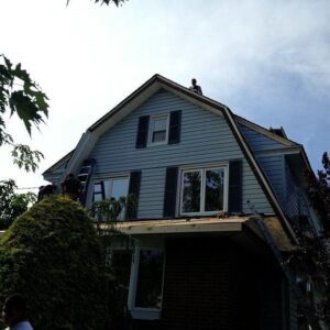 two story roof with blue trim windows